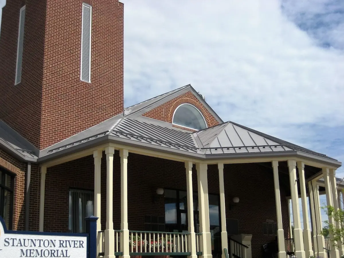 Skilled roofing craftsmen working on a residential roof in Auburn